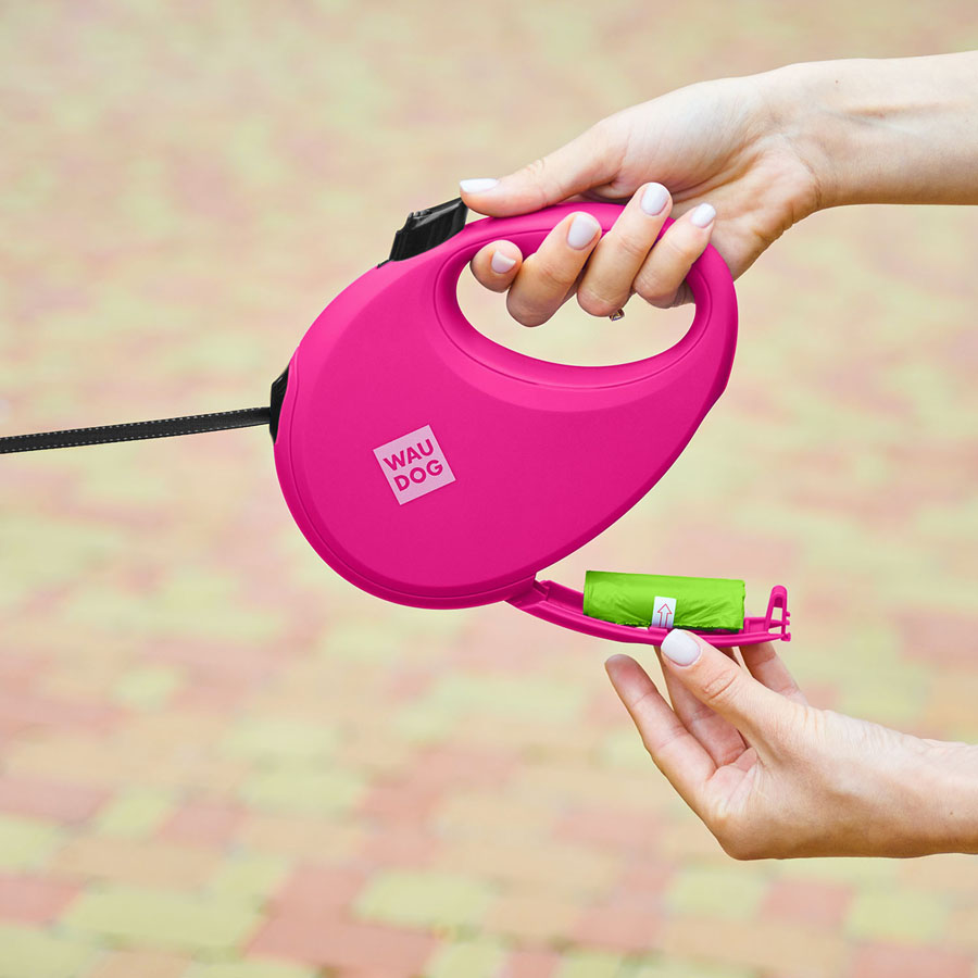 Повідець-рулетка для собак WAUDOG R-leash з контейнером для пакетів, світловідбивна стрічка, L, до 40 кг, 5 м, рожевий