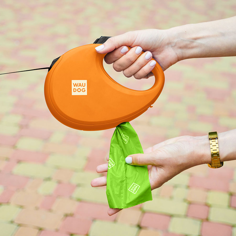 Повідець-рулетка для собак WAUDOG R-leash з контейнером для пакетів, світловідбивна стрічка, L, до 40 кг, 5 м, помаранчевий