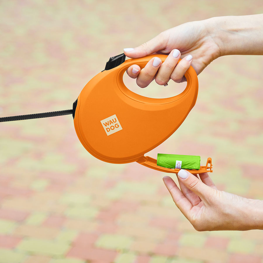 Повідець-рулетка для собак WAUDOG R-leash з контейнером для пакетів, світловідбивна стрічка, L, до 40 кг, 5 м, помаранчевий