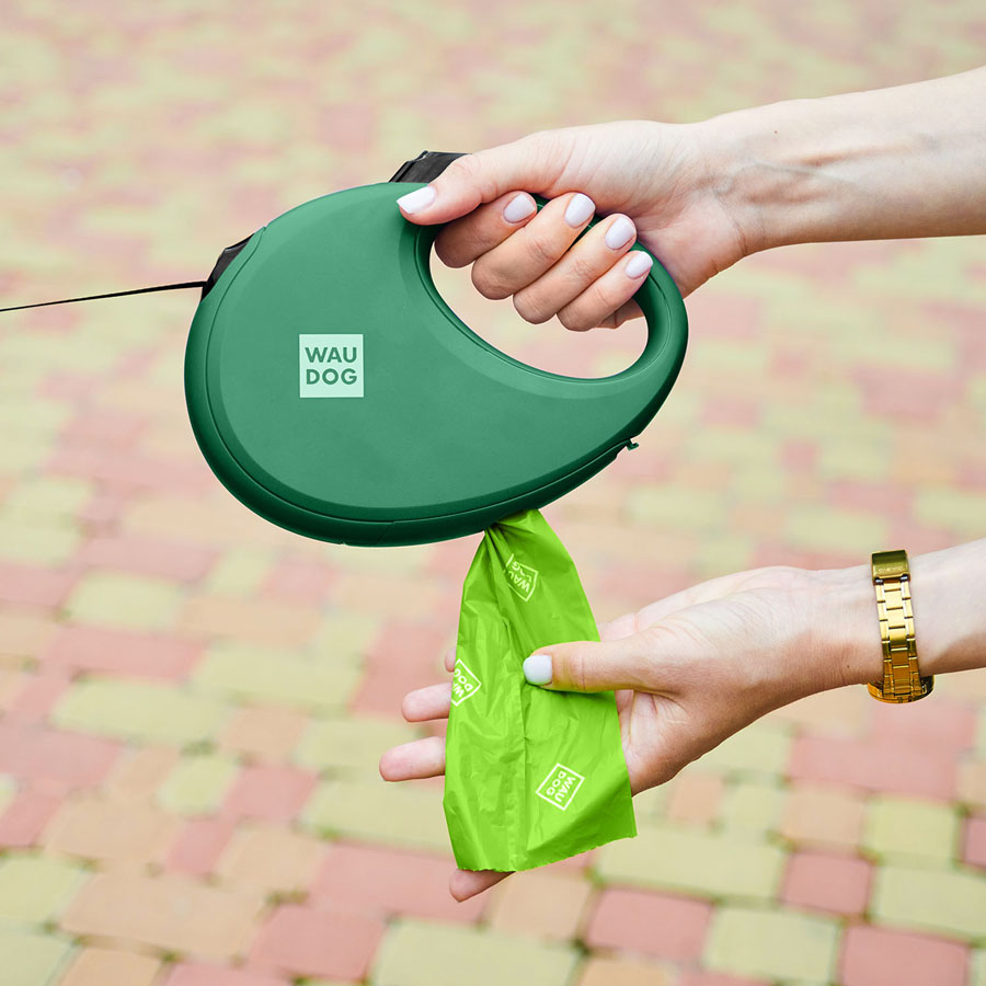 Повідець-рулетка для собак WAUDOG R-leash з контейнером для пакетів, світловідбивна стрічка, L, до 40 кг, 5 м, зелений